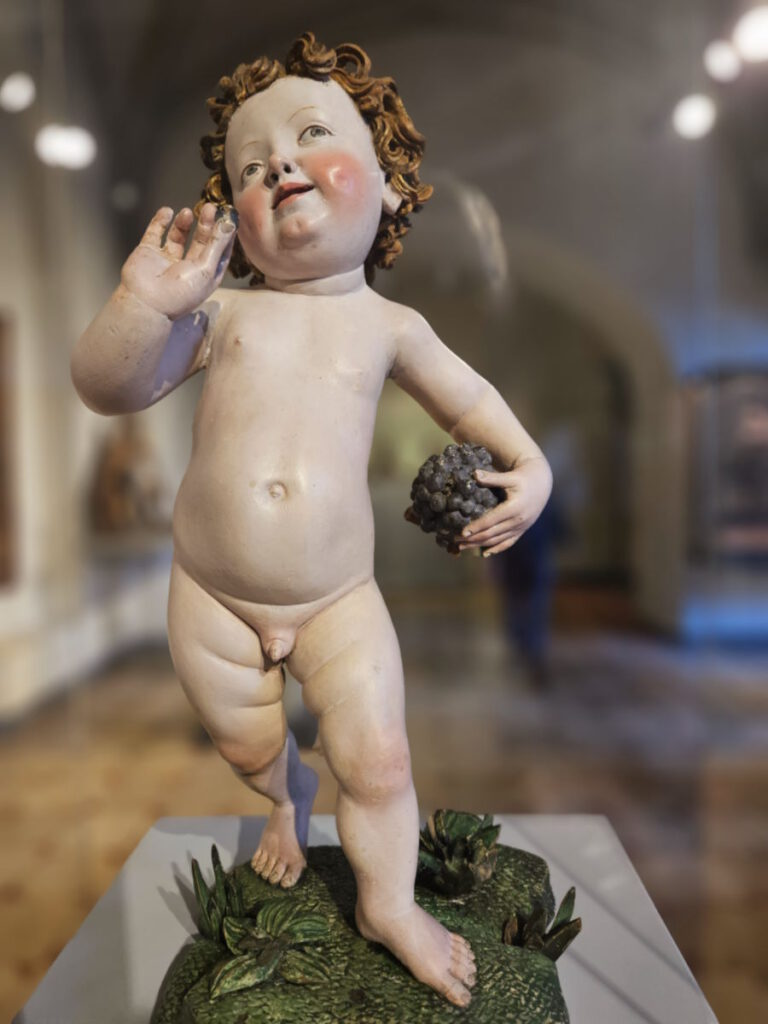 Jesuskind mit Weintraube CLICK REFRESH